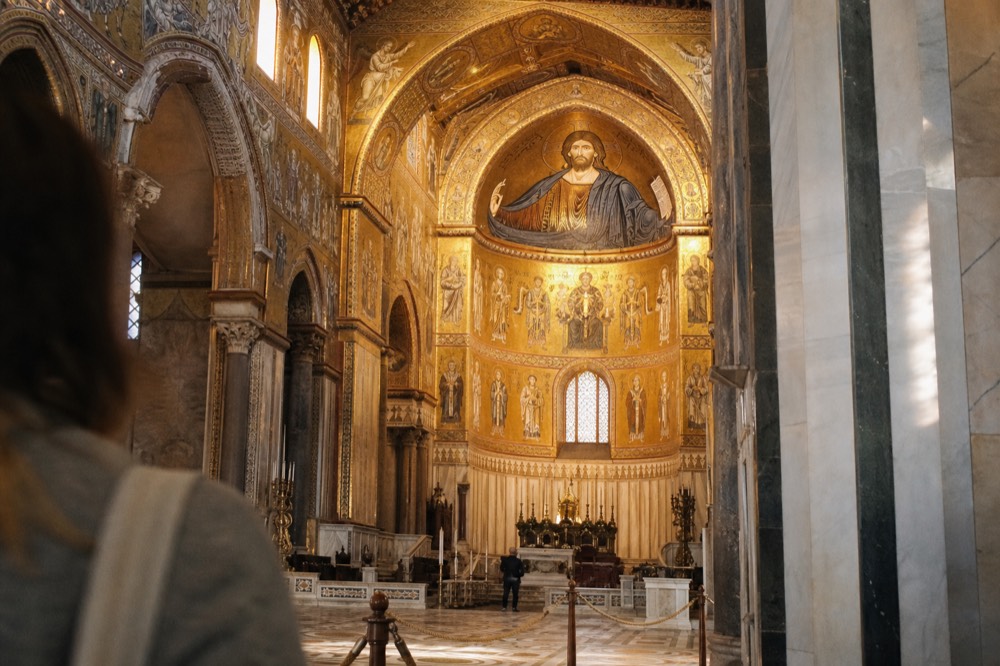 The mosaic-covered interior of Monreale cathedral, golden Christ Pantocrator in the apse