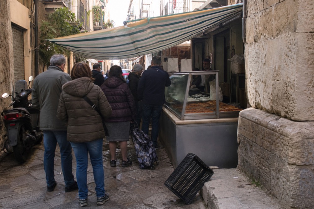 Market stalls along a narrow street in the Ballaro district of Palermo