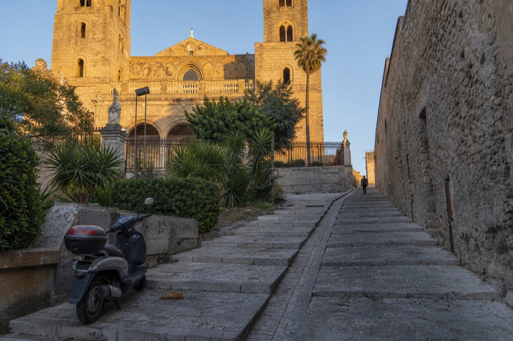 Hilltop town of Erice seen from below with stone buildings under a clear sky