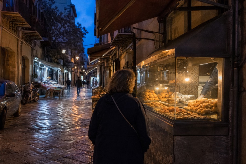 A street food stand in Palermo selling fried snacks from a glass case
