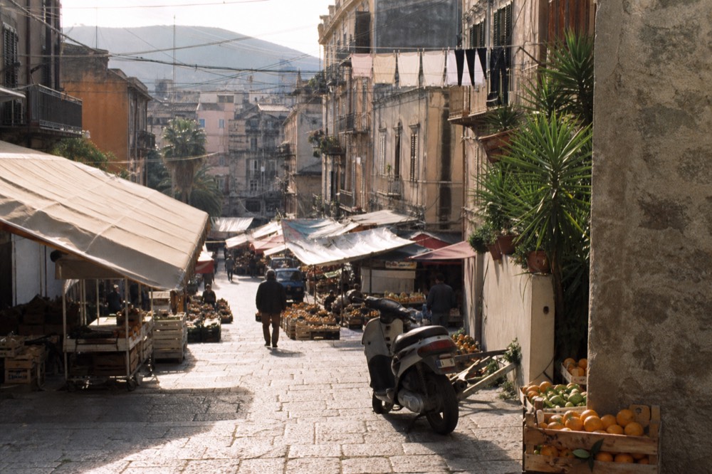 Sicilian street food stalls along a market street in Palermo