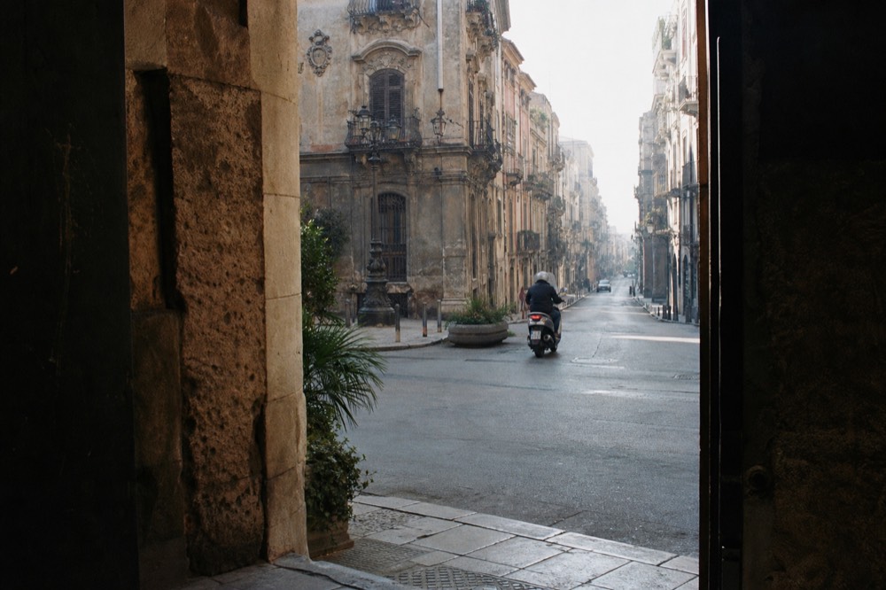 A street sign marking a limited traffic zone in a Palermo street