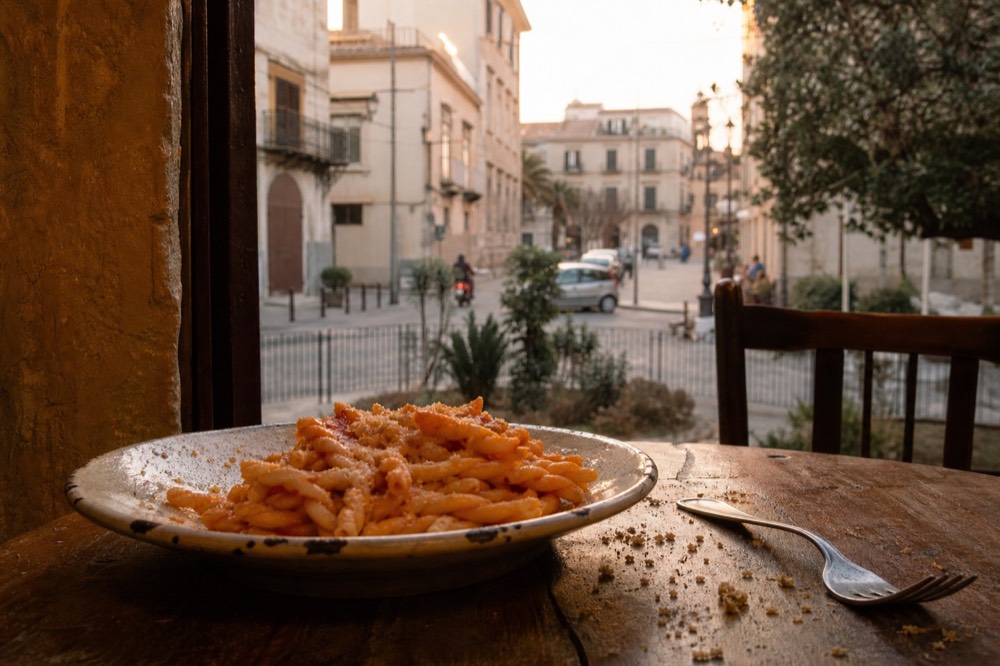 Twisted spiral pasta with tomato and almond sauce on a plate